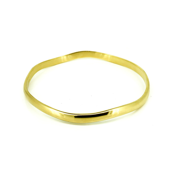Wave Bangle Gold crafted in premium gold vermeil over sterling silver featuring an elegant polished wave-inspired coastal design.