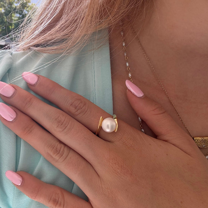 Whirlpool Pearl Ring Gold featuring a genuine freshwater pearl set in a swirling gold vermeil design over 925 sterling silver.