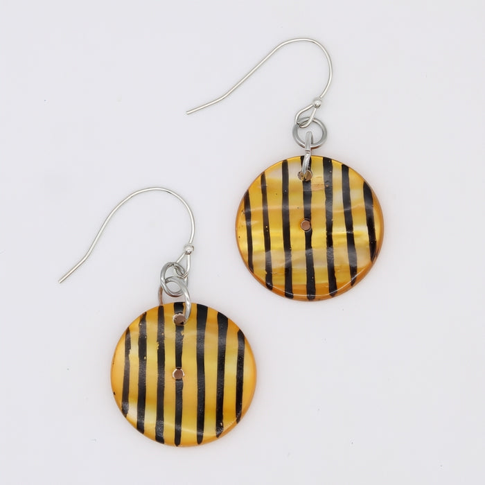 Yellow and black striped earrings on a white background