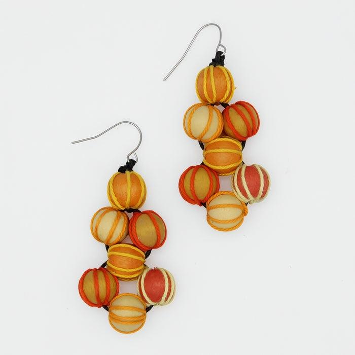 Pair of colorful beaded earrings on a white background
